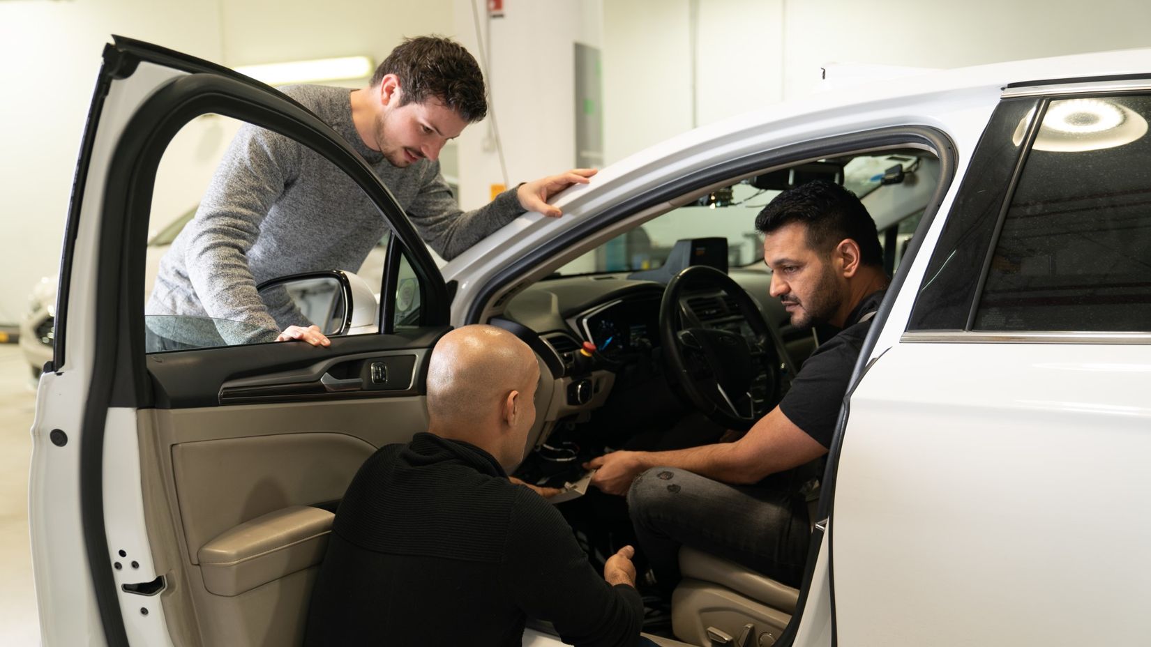 Mobileye test drivers in the autonomous-vehicle workshop at our headquarters in Jerusalem, Israel.