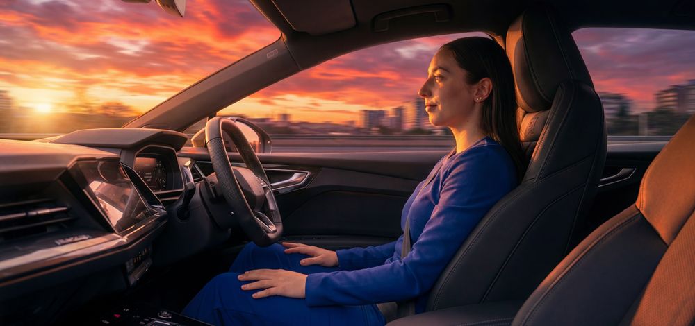 Image of a woman driving hands-free.