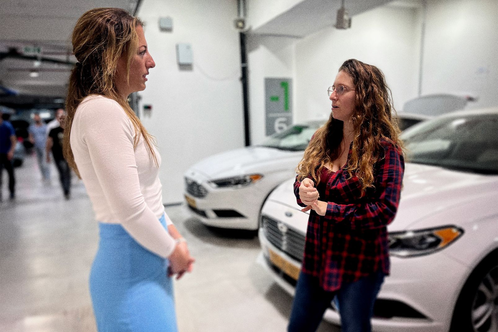 Woman engineers like Shira Hirsh and Tomer Hochbaum work alongside men in Mobileye’s various engineering departments.