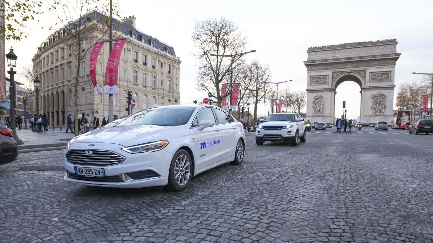 A Mobileye self-driving vehicle operates autonomously while testing on the Champs-Élysées in Paris, France.